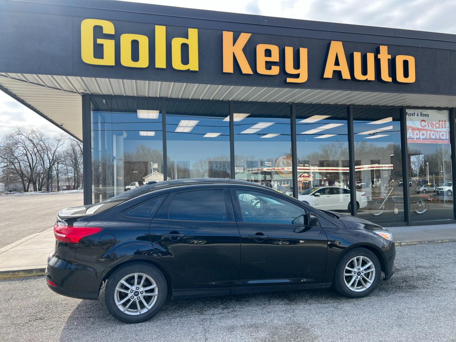 2018 Shadow Black Ford Focus SEDAN 4-DR (1FADP3FE7JL) with an 1.0L L3 engine, located at 1633 W Kimberly, Davenport, IA, 52806, (563) 323-5341, 41.559456, -90.598732 - Photo #0